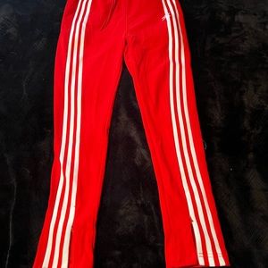 Women’s high waisted Adidas slim fit track pants.